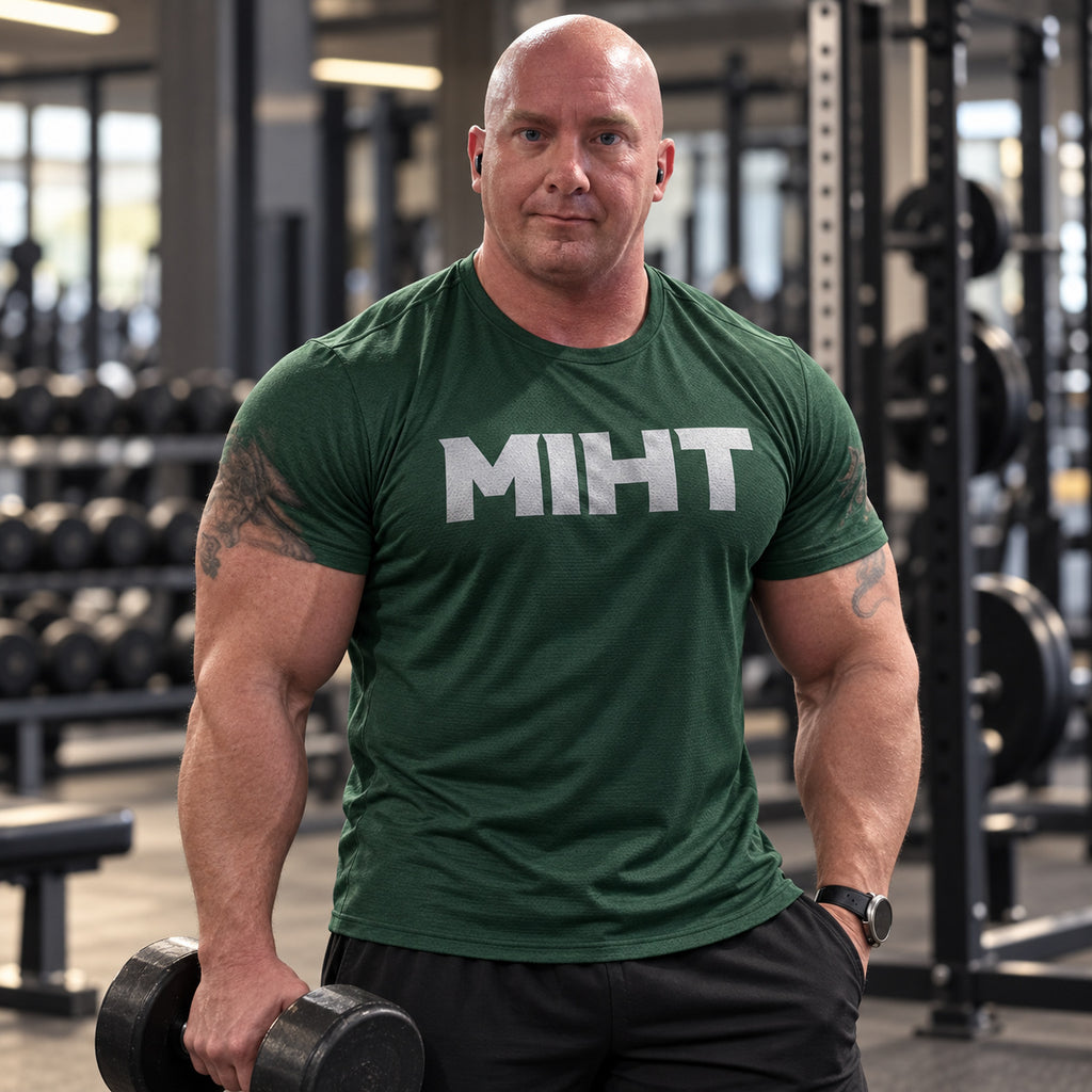 Model wearing the MIHT Core Performance Tee in forest green